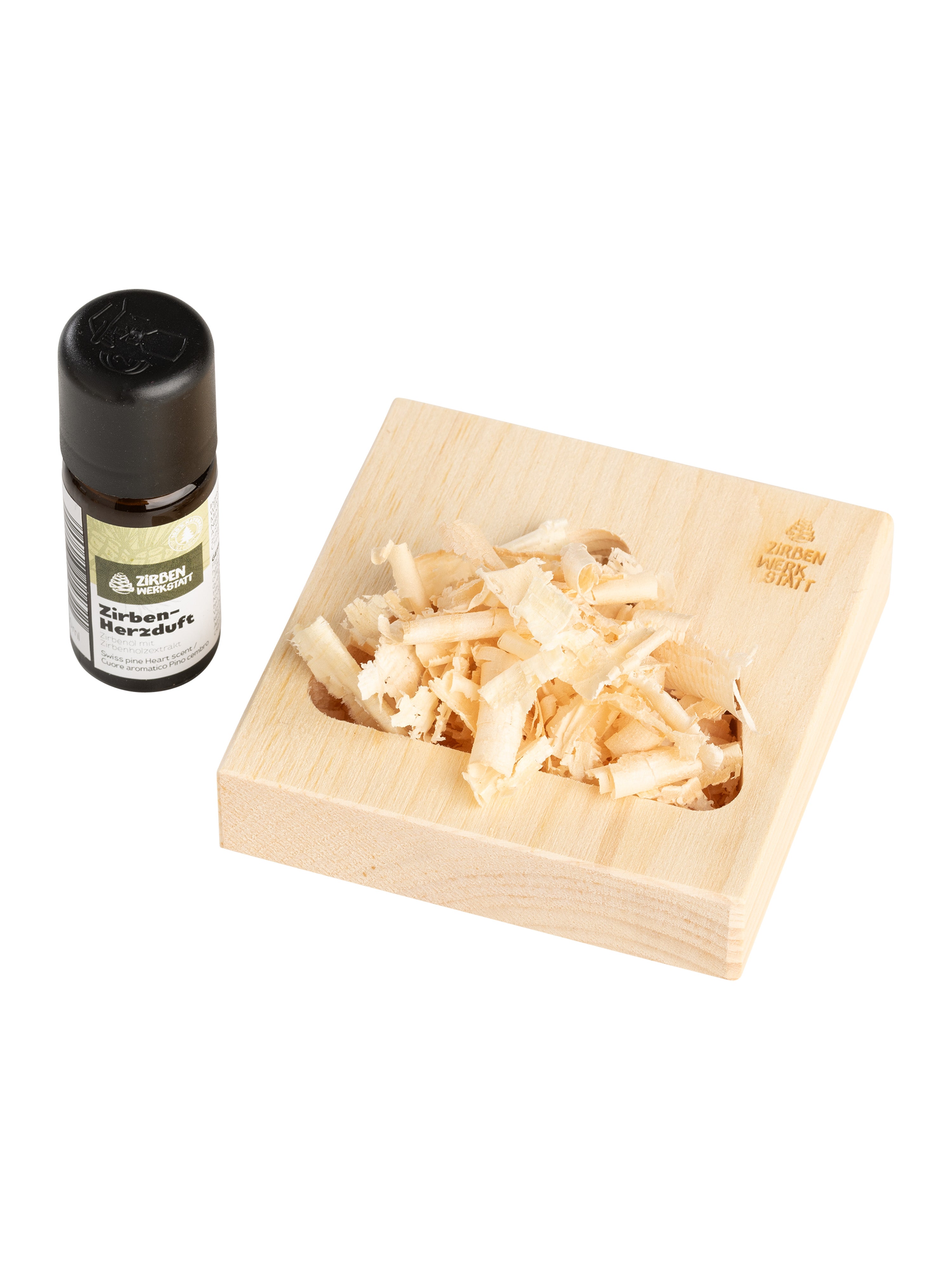 Zirbenholz mit Berg-Motiv zum befüllen der Zirbenspäne und ein Zirben Duftöl